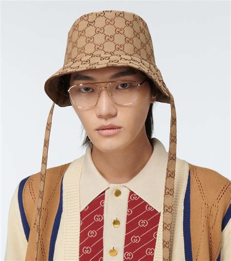 reversible gucci bucket hat|Gucci bucket hat with strings.